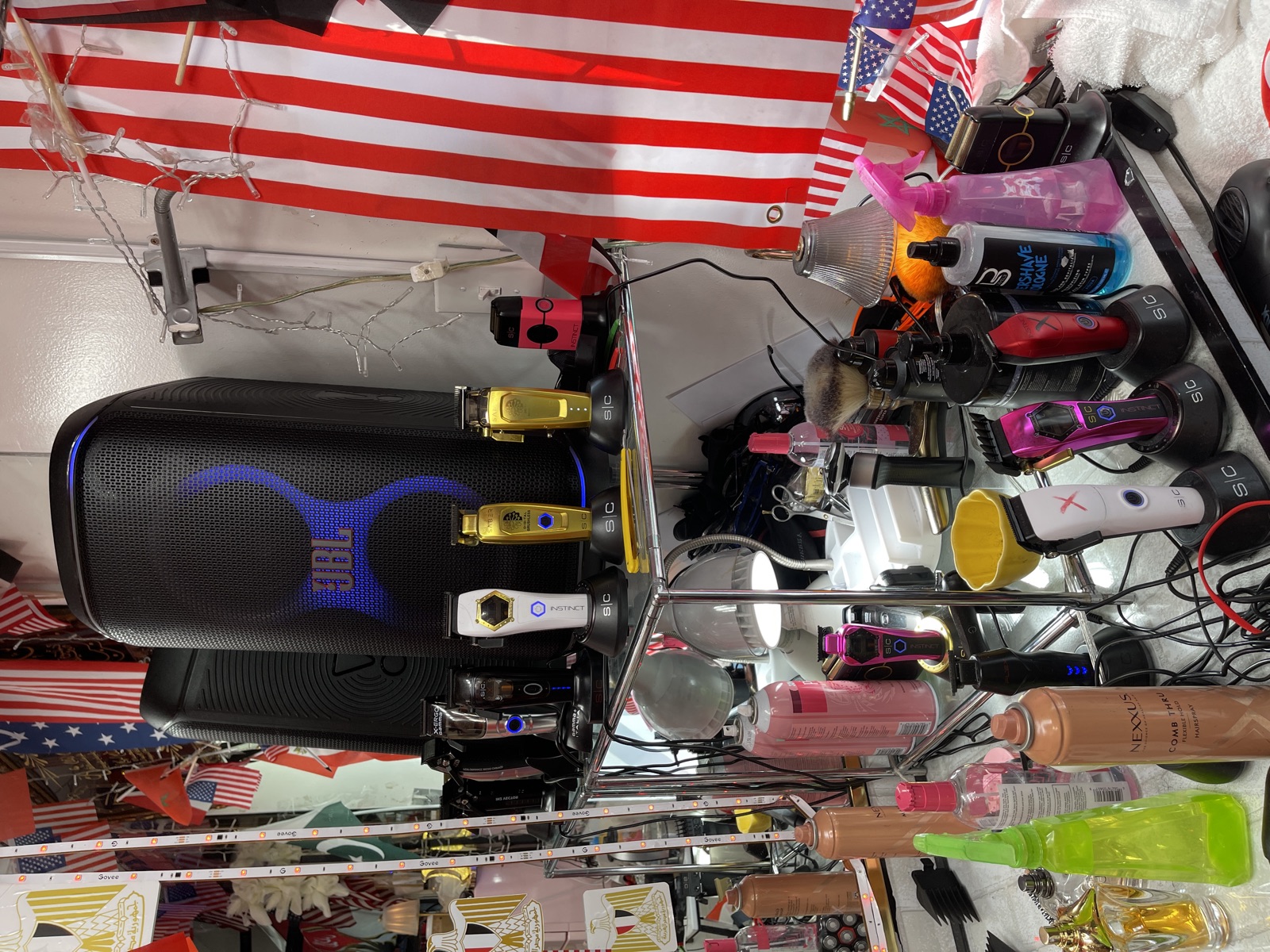 Clippers and supplies laid out at a barber station