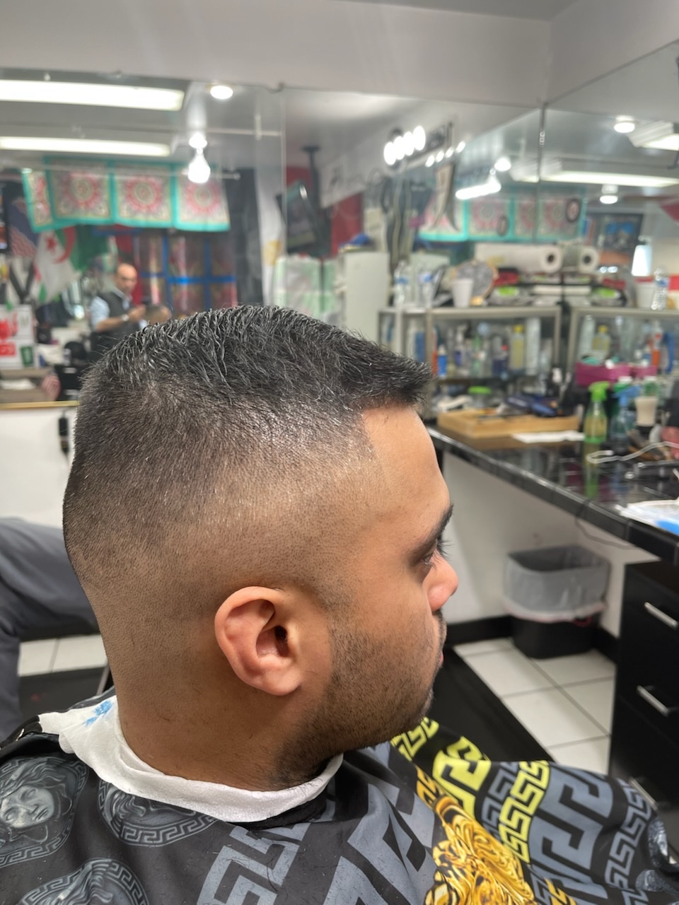 Waves on top with a clean skin fade, seen from the back